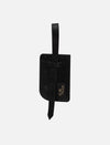 Black textured leather luggage tag with strap and Eco Nook logo on white background