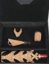 Black gift box containing cork wine bottle holder, cork keychain, cork bracelet, and cork mini bag