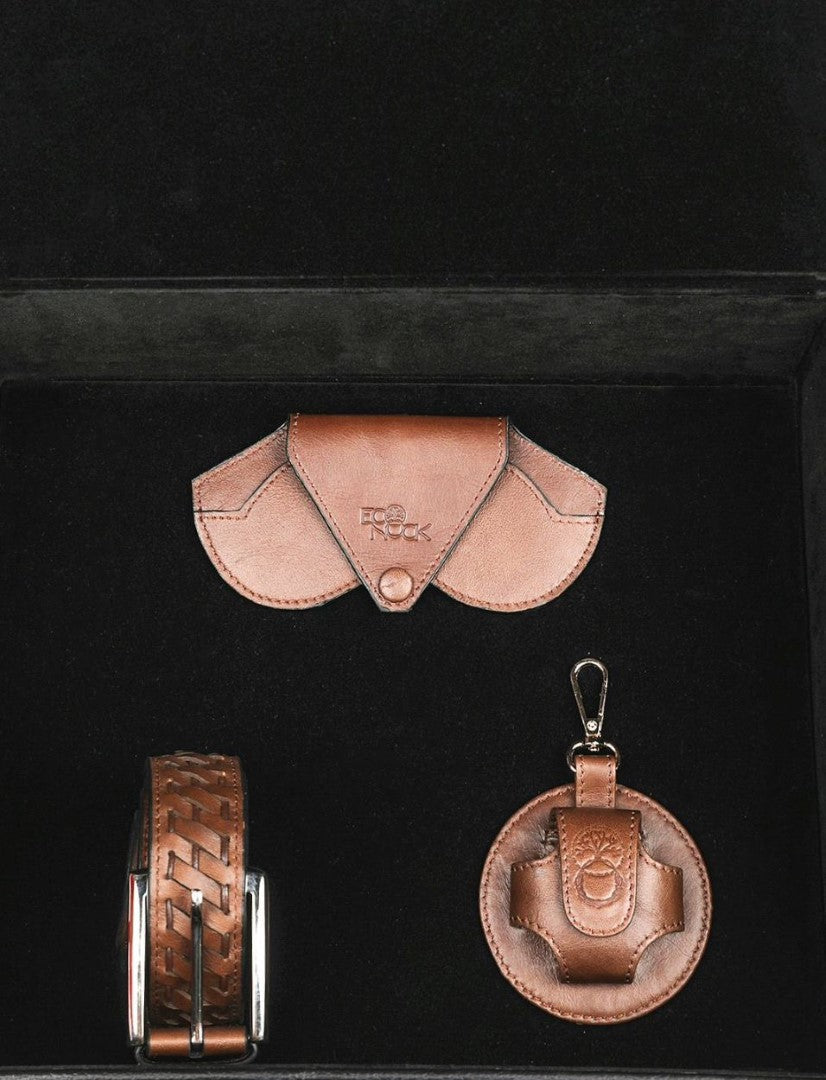 brown leather belt, wallet, and round keychain in black case