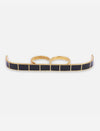 Gold metal multifinger ring with rectangular black enamel inlays and two connected finger bands on white background