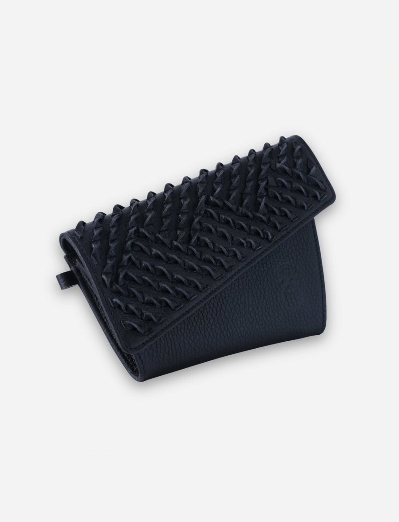 Timeless black leather wallet with woven textured flap handcrafted in India on white background