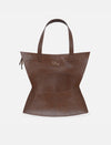 brown upcycled leather tote bag with unique hourglass shape and double handles on white background
