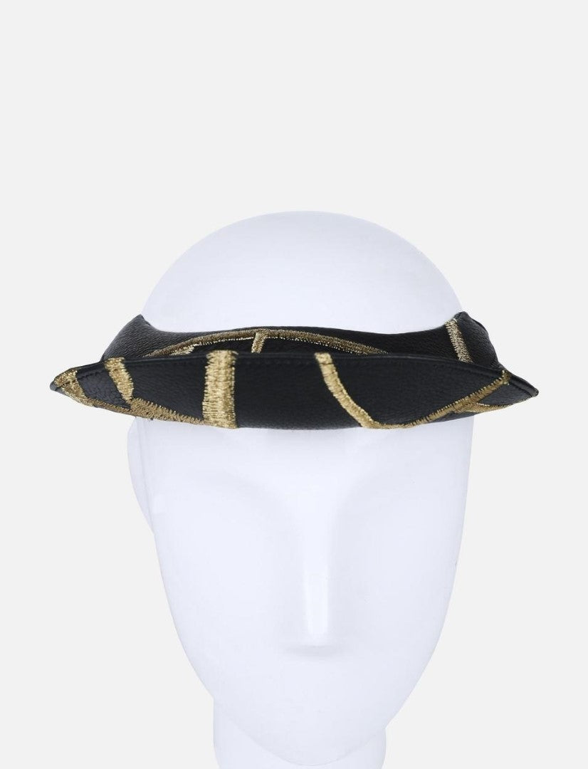 Black leather visor hat with gold embroidered stripes on white mannequin head