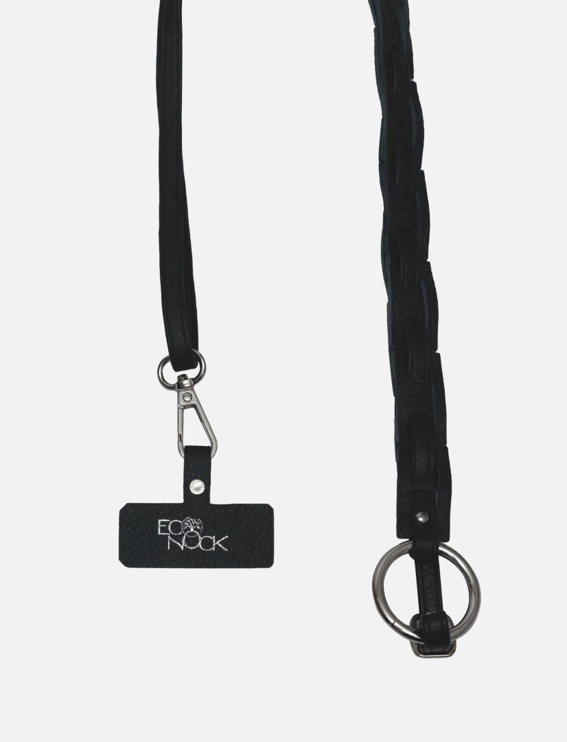 Black upcycled leather phone sling with silver O-ring and EcoNook logo tag on white background