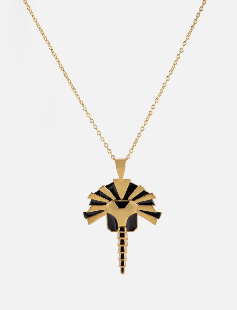 Gold and black enamel pendant necklace with a stylized lion head design on a gold chain