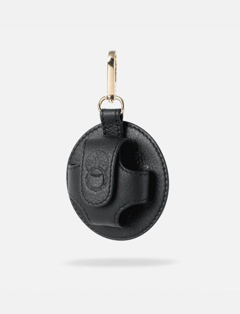 Black upcycled leather AirPods case with embossed tree logo and gold metal clip