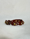 Timeless cinnamon vegan leather cuff bracelet with gold metallic beads on white background