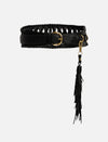 Black leather belt with braided edges, gold buckle, and long tassel accessory on plain background