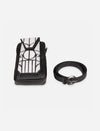 Black leather thigh bag with white applique design and matching black leather belt on white background