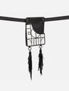 Black leather thigh bag with geometric white applique and two long black fringe tassels