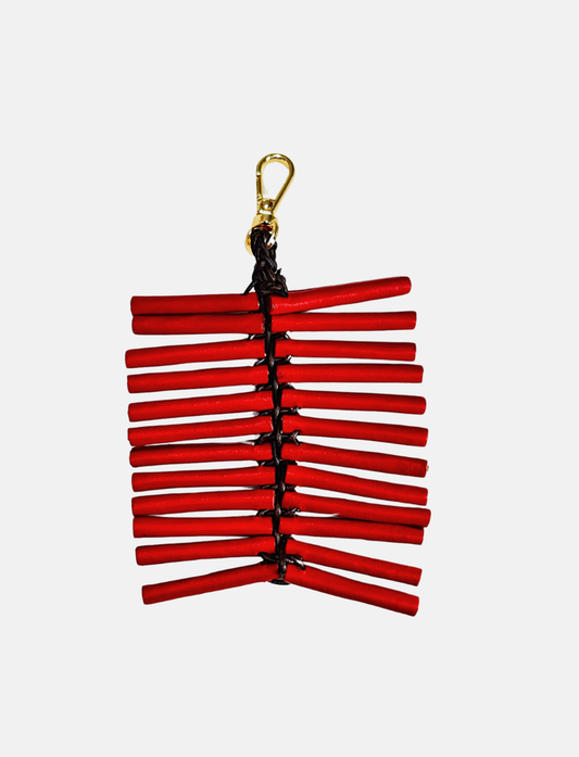 Red firecracker string with gold clasp on white background