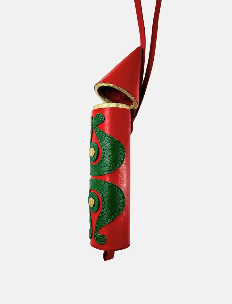Red leather rocket-shaped hanging charm with green decorative patterns and gold accents